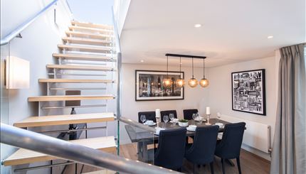 Dining area with stairway to private terrace